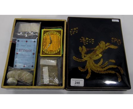 Bezique games box, the oriental lacquer box decorated with exotic bird, enclosing compartments and The Pocket Guide to Beziqu