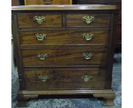 Small mahogany chest of drawers with moulded edge top, two short and three long graduated drawers, on ogee bracket feet, widt