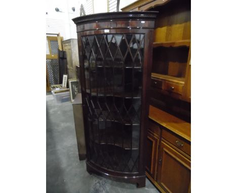 Georgian-style mahogany bowfront corner cupboard with carved Greek key cornice, the astragal-glazed door enclosing four shelv