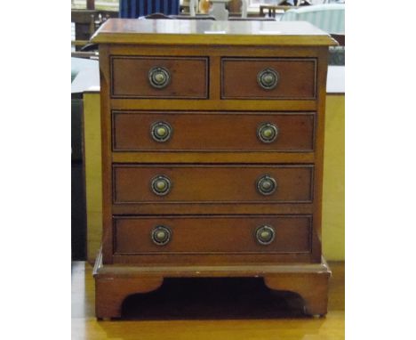 Contemporary yew wood veneer miniature chest of two short and three long graduated drawers, on bracket feet, width 42cm 