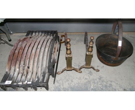Metal firegrate, two metal firedogs, a jam pan and a metal fireguard 