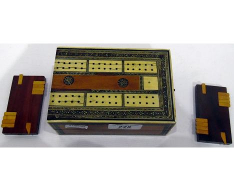 Middle Eastern inlaid travelling cribbage board and a pair of games markers (3) 