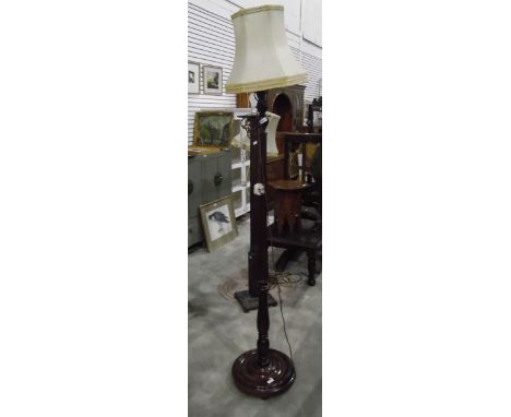 Turned and fluted mahogany lamp standard on circular platform base 