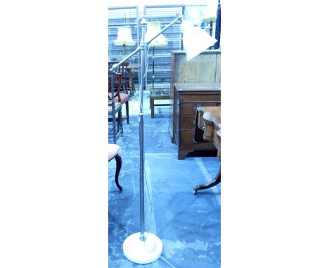 A chrome adjustable reading lamp with white enamelled shade, on circular foot 