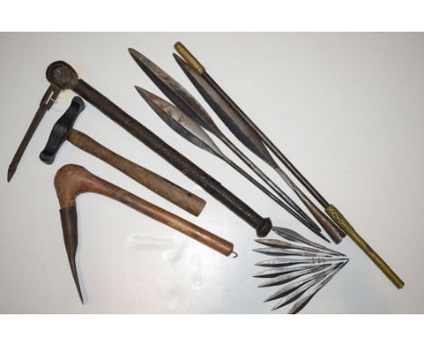 West African tribal items, to include: spears; an axe; and other items.