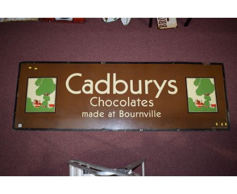 'Cadburys Chocolate' enamel advertising sign, inscribed "Cadburys Made at Bournville, flanked by Art Deco scenes of the facto