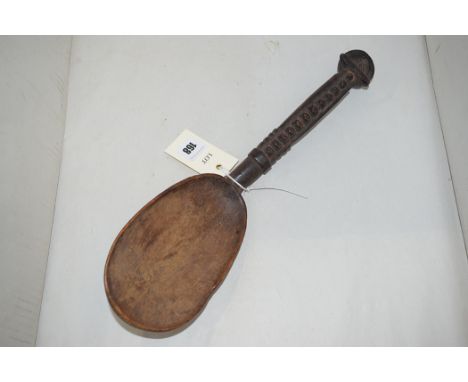 A West African carved wooden spoon, 36cms.