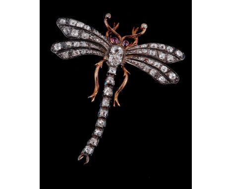 A late Victorian diamond and ruby dragonfly brooch,   circa 1890, set with old cut diamonds, approximately 1.30 carats total