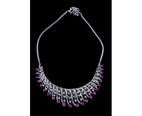  A 1960s French ruby and diamond necklace,   the central curving panel set with brilliant cut, eight cut and baguette cut dia