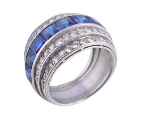  An Art Deco sapphire and diamond ring,   circa 1930, the band set with a central row of square cut sapphires, between steppe