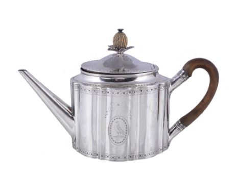 Ω A George III silver commode shape tea pot by Samuel Godbehere &amp; Edward Wigan, London 1786, with a carved ivory pineappl