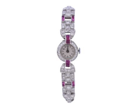  A lady's white gold coloured, diamond and synthetic ruby cocktail watch,   circa 1930, Swiss manual wind movement, 17 jewels