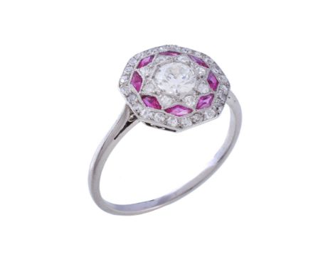  An early 20th century ruby and diamond ring,   circa 1910, the central brilliant cut diamond, estimated to weigh 0.45 carats