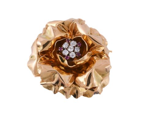  A 1950s diamond and ruby flower head brooch,   the flower head with a central cluster of old cushion cut diamonds, approxima