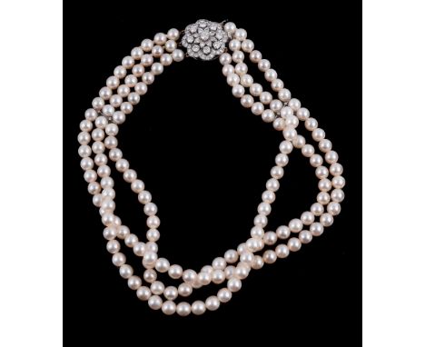  A three row cultured pearl necklace,   the three rows composed of uniform cultured pearls, to the flower head clasp set thro