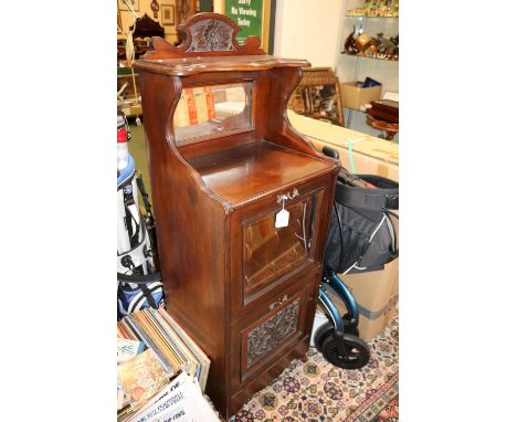Late 19thC Mahogany Music Cabinet with mirrored back Glass fronted rack and drawer with carved panel to base 