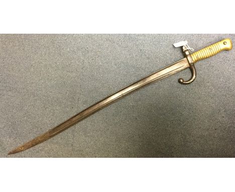 French 1866 Pattern Chassepot Bayonet, dated 1874 to spine of 58cm long fullered single edged blade. Brass hilt. No scabbard.