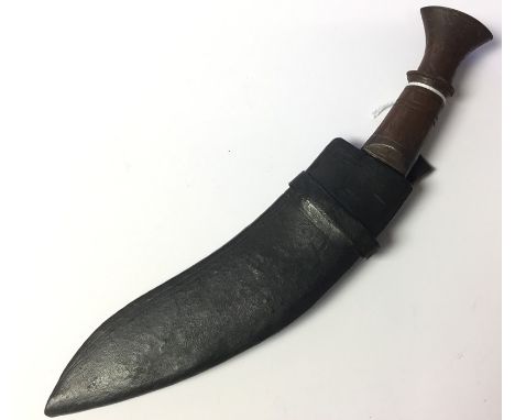 Small sized Gurhka Kukri knife with 19.5cm long blade. No makers markings. Wooden grip. Overall length 28cm. Complete with wo