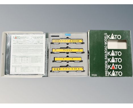 A Kato N scale 106/024 smooth side passenger four car set