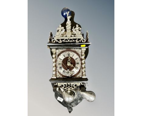 A Continental silvered wall clock with pear drop weights 