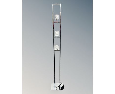 A contemporary chrome and glass standard lamp 
