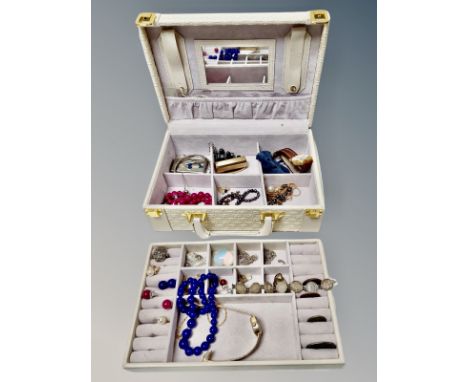 A contemporary jewellery chest and contents to include coin bracelet, costume jewellery, novelty lighter, gent's watch