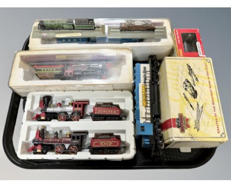 A group of HO scale die cast locomotives and model locomotives on plinths, Matchbox Stephenson's Rocket model, boxed Hornby r