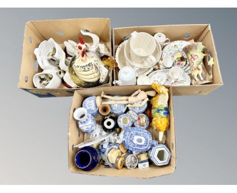 Three boxes of ceramic swan ornaments, oriental china, blue and white vases, Tang style horse  etc 