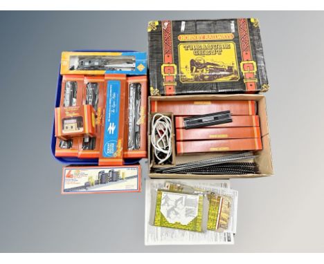A Hornby Railways Treasure Chest box containing boxed 00 gauge carriages, track, control unit, a further tray of Hornby, Lima