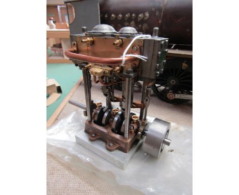 A model engineering twin steam engine with cylinders, motion and flywheel, 16cm tall 