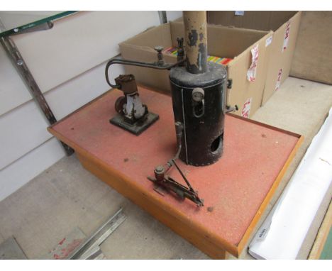 A hand built live steam vertical boiler and attachment engine flywheel on raised base 