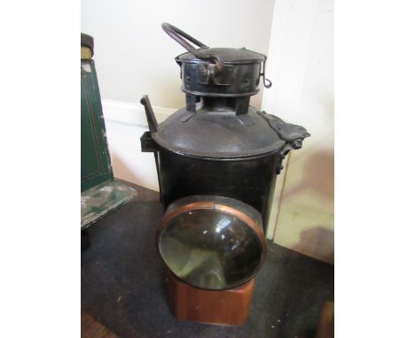 A GWR signal lamp exterior with matching interior on wooden block 