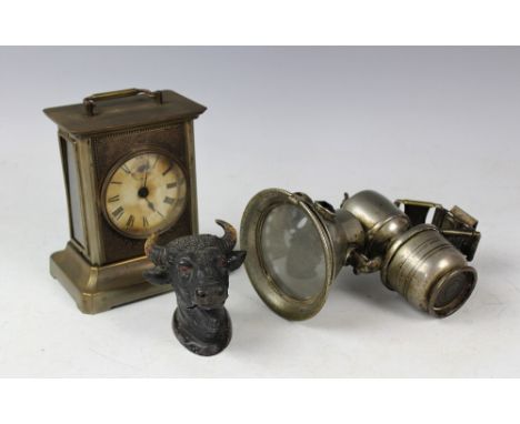 A late 19th century planished metal carriage time piece, possibly American, with Roman numeral dial and eight day movement, 1