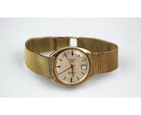 A 9ct Gold Longines Automatic Admiral wristwatch, the silvered dial with gilt batons, centre sweep seconds and calendar apert