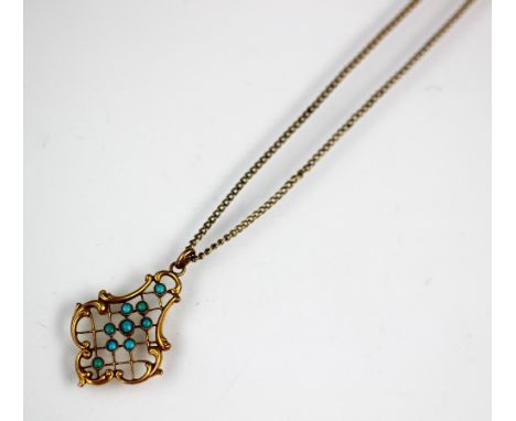An openwork pendant, of scroll form and with central trellis design set with nine turquoise coloured stones, stamped '9ct', a