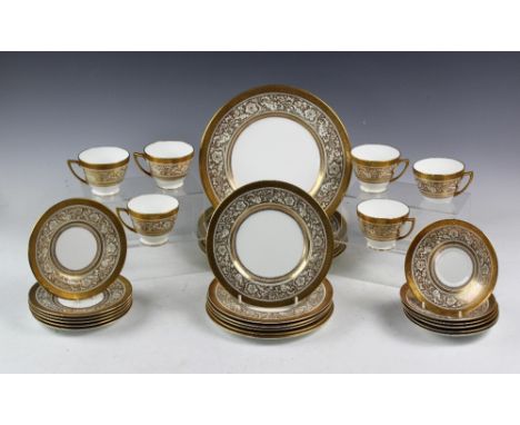 A Minton porcelain 'Boule' pattern dinner service, comprising; six tea cups, six saucers, six side plates, six further plates