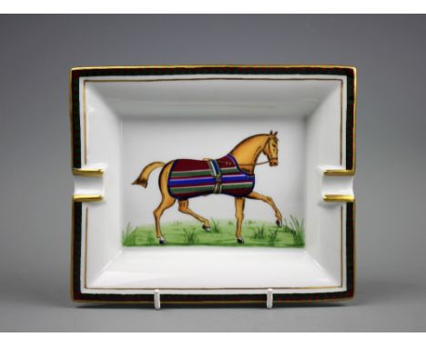 An Hermes of Paris equestrian cigar tray, the rectangular tray centrally decorated with a trotting horse in a striped turn-ou