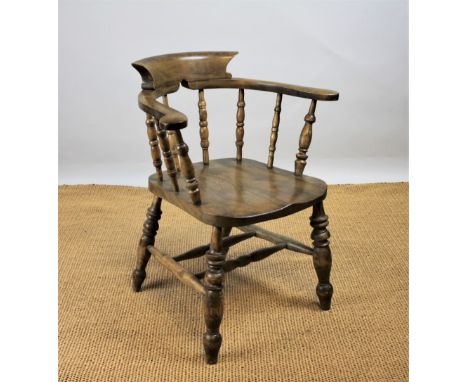 A Victorian beech and ash captains chair, with turned spindle back and solid seat, on turned legs,80cm H CONDITION REPORT: Li