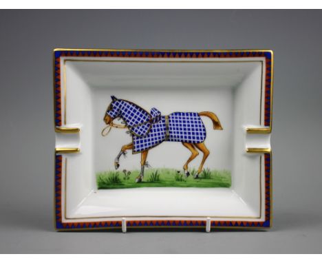 An Hermes of Paris equestrian cigar tray, the rectangular tray centrally decorated with a trotting horse in a blue checkered 