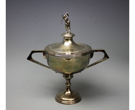 A George V silver golfing trophy and cover, Turner and Simpson Ltd, Birmingham 1928 and 1930, the cover surmounted with a fig