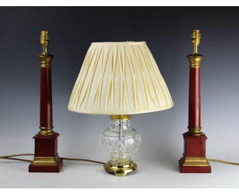 A pair of modern red and gilt painted column table lamps, 48cm high, with a modern glass and brass table lamp, and a modern c