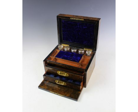 A Victorian burr walnut dressing table box, with hinged lid and fall front enclosing a fitted interior, mirror to underside o