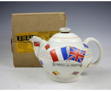 A WWII novelty teapot 'The War Against Hitlerism' by Crown Ducal for Dyson and Horsfall of Preston, decorated with flags of t