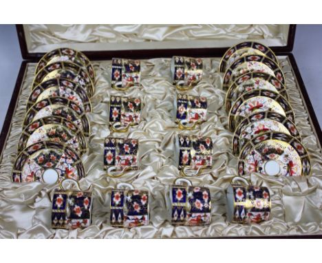 A collection of Royal Crown Derby imari pattern 2451 tea wares comprising; a part cased set of ten coffee cans and twelve sau