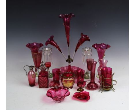 A selection of glass ware and lustres to include a large cranberry glass epergne with three flutes upon a bowled base, 46.5cm