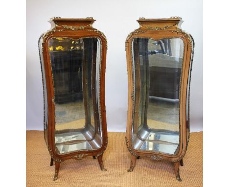 A pair of French Louis XV style gilt metal mounted walnut vitrines in the manner of Francois Linke, mid 20th century, with ga