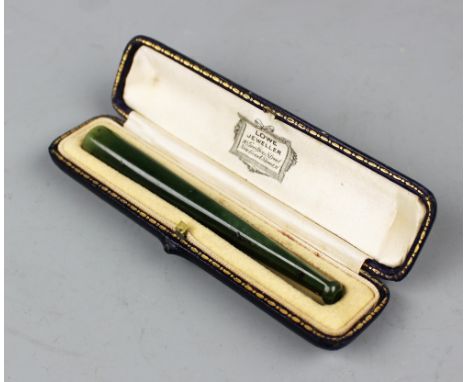 A nephrite jade cheroot/cigarette holder, 9.8cm long, within a fitted 'Lowe Jeweller, New Bond Street' case  CONDITION REPORT