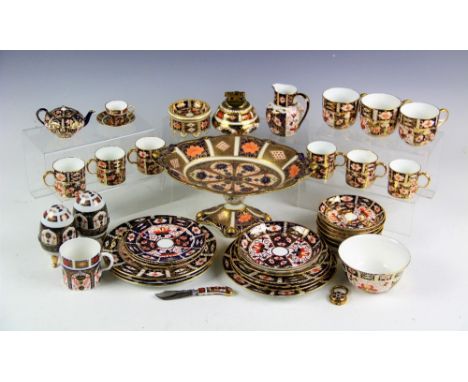 A large selection of Royal Crown Derby Imari 2451 pattern wares including a set of six coffee cans and saucers, a larger coff