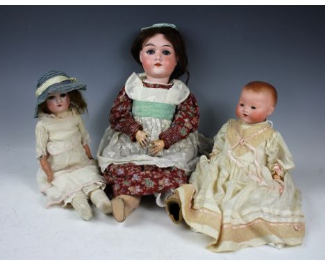 An Armand Marseille 370 doll, with sleeping eyes and open mouth revealing four upper teeth, brown wig on a bisque head  upon 