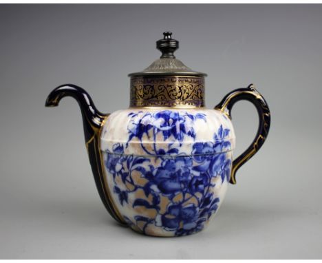 A Royal Doulton Burslem patent self pouring teapot, with flow blue floral detailing and pewter lid, 22cm CONDITION REPORT: St